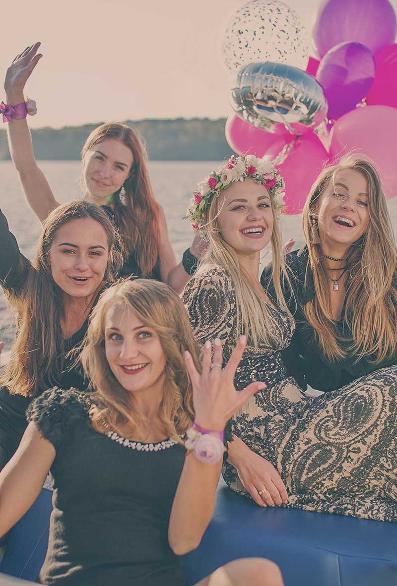 Bride to be and maids with colourfull balloons in the background having fun on Okanara boat. kelowna stagette